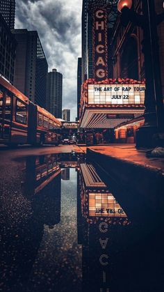 the marquee for the art of hair fair is reflected in a pool of water