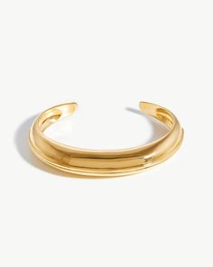 MISSOMA Dome Ridge Cuff Bracelet An everyday cuff with a minimalist domed design. Easy to slip on and off, this bracelet features our signature triple ridge detailing. Wear on its own, or team with other bracelets and cuffs for the ultimate arm stack. Composition: 18ct Gold Plated on Brass Color: YG Size: H-41mm W-12mm Diameter-58.6mm Arm Stack, Finger Bracelets, Gold And Silver Bracelets, Modern Bracelets, Chain Belts, Metal Shop, Gold Bracelets, Monogrammed Items, Bracelets For Women