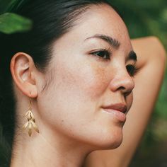 Softly swaying brass bamboo leaves hang from gold-dipped brass ear wires. Nickel and lead-free.1.75" [4.5 cm] long. Nature-inspired Gold Earrings With Ear Wire, Gold Leaf-shaped Nature-inspired Earrings, Gold Leaf Nature-inspired Earrings, Nature-inspired Gold Earrings, Nature-inspired Gold Leaf Earrings, Gold Nature-inspired Earrings For Everyday, Nature-inspired Gold Earrings For Everyday, Nature-inspired Gold Leaf-shaped Earrings, Leaf-shaped Brass Earrings With Ear Wire