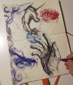 someone is drawing something with colored pencils on top of a piece of white paper