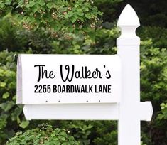 a white sign that says the walker's on it in front of some bushes