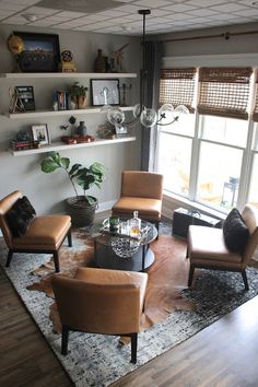 a living room filled with furniture next to a window