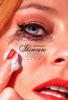 a woman with red and white nail polish on her face is holding onto the cover of an ad for skincare