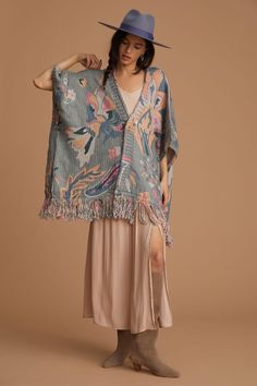 A chic and comfy layering piece, the Elora Knit Tassel Kimono displays floral and leaflet motifs, fringed edges, and is made from soft fabric that will keep you cozy this fall and winter. It is designed to rest comfortably on your shoulders and can be styled with the front open or fastened closed with a belt or pin for a more structured look. Material: Acrylic Size: 25" x 40" + 5.5" Fringe Corn Silk, Floral Duster, Duster Cardigan, Cool Fits, Natural Life, Trendy Accessories, 50 Fashion, Layering Pieces, Ponchos