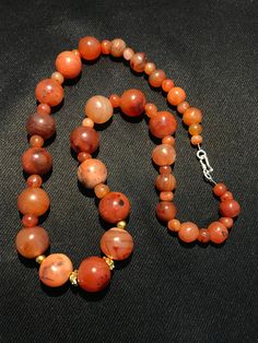 A beautiful 900 years old Pre Ankur carnelian beads necklace from Cambodia, worn by royals at that time as a luck charm. agate beads as counters. In great condition and colors of the beads are exceptional with great shine on its surface as its been continuesly used since then till now. Polished Round Carnelian Beads, Gems, And Cabochons, Carnelian Gemstone Beads Necklace, Carnelian Gemstone Beaded Necklaces, Carnelian Beaded Necklaces With Gemstone Beads, Carnelian Polished Beads Necklace, Carnelian Gemstone Round Beads, Carnelian Beaded Necklace With Polished Round Beads, Polished Carnelian Beaded Necklaces, Carnelian Beaded Necklaces With Polished Round Beads