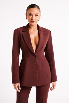 Strong feelings.GREER is a long-sleeved blazer with a plunging neckline, sewn-in shoulder pads, and front button closure. A cinched waist paired with wide shoulders and a slightly structured fit create a silhouette that’s powerfully feminine and universally flattering. Subtle details, like the self-fabric-covered buttons and the faux breast pocket, add visual texture to the blazer’s modern minimalist vibe. Crisp, clean, and a suiting classic, this blazer layers perfectly with wide-legged pants, Dark Chocolate Color, Corporate Baddie, Wide Shoulders, Dresses Date Night, Workwear Essentials, Black Dress Prom, Strong Feelings, Chocolate Color, Black Wedding Dresses