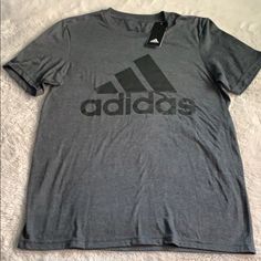 New Dark Gray Adidas T-Shirt Black Tri-blend Casual Shirt, Casual Black Tri-blend Shirt, Adidas Gray Cotton Tops, Gray Logo Print Casual Shirt, Gray Casual Shirt With Logo Print, Casual Gray Shirt With Logo Print, Gray Crew Neck Shirt With Logo Print, Casual Gray Sports Shirt, Gray Adidas