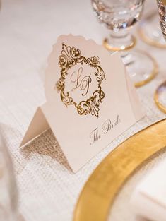 a place setting with wine glasses and napkins