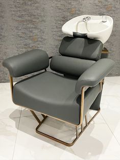 a reclining chair with a sink on top of it's backrests