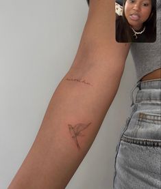 a woman with a small tattoo on her arm