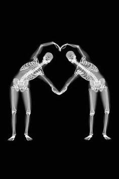 two skeletons making a heart shape with their hands