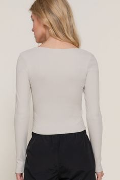 Elevate your wardrobe with our Long Sleeve Sweetheart Neck Seam Detail Knit Top, designed to combine style and comfort effortlessly. Crafted with precision, this top is perfect for adding a touch of sophistication to your everyday look.Key Features:- Fabric: Soft knit blend of polyester and spandex- Fit: Relaxed yet flattering fit- Color Options: Elegant Silver- Sizes: Available in Small, Medium, and Large- Design: Features a sweetheart neckline with seam detailing and long sleeves- Versatile St Fitted V-neck Top For Spring Layering, Versatile Fitted V-neck Knit Top, Seamless Long Sleeve Top With Minimal Stretch, Fitted Long Sleeve V-neck Top, Fitted Solid Color Long Sleeve V-neck Top, Ribbed V-neck Elastane Top, Fitted Solid V-neck Knit Top, Solid Color Fitted V-neck Knit Top, Chic Knit Top For Fall