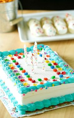 a birthday cake sitting on top of a wooden table