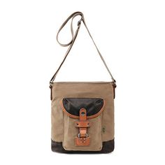 Enjoy the sturdy quality and charming style of our Tapa crossbody bag boasting earthly colors and conveniently compartmentalized interior. Carry your essentials on your daily commute, hiking trip, or a casual outing. A zipper pocket on the back allows quick access to your most frequently used items. Crafted with 100% cotton canvas makes it remarkably study, and the 100% genuine leather accents adds a touch of vintage charm.Included: 1 Key Ring StrapFeatures: Adjustable Straps, Lead FreeClosure T Functional Brown Crossbody Shoulder Bag, Functional Crossbody Canvas Bag With Adjustable Strap, Practical Brown Shoulder Bag With Cell Phone Pocket, Functional Brown Crossbody Canvas Bag, Outdoor Crossbody Shoulder Bag With Leather Handles, Beige Crossbody Camera Bag For Everyday Use, Practical Brown Canvas Shoulder Bag, Practical Brown Satchel For Everyday Use, Beige Saddle Bag For Everyday Use