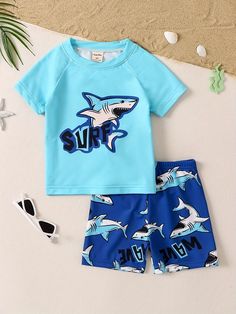 👚This fun and playful shark pajama set is perfect for boys who love the ocean. The blue and white print is both stylish and comfortable, and the loose-fitting design allows for plenty of movement. Slip your little one into this pajama set and let them dream of swimming with the sharks.🦈 #pajamas #sleepwear #boys #shark #cartoon #ocean #blue #white #comfortable #fun #playful #fashion #style #ootd #pinterest White Swimwear For Ocean Activities And Beach Season, White Swimwear For Ocean Activities During Beach Season, White Swimwear For Summer Ocean Activities, Playful Green Sets For Vacation, Short Sleeve Swimwear For Beach, Fun Short Sleeve Swimwear For The Beach, Fun Short Sleeve Swimwear For Beach, Playful Green Vacation Sets, Playful Summer Sets With Letter Print