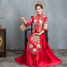 Looking a traditional Chinese bridal gown. This beautiful 2-piece qun kwa set is embroidered with gold, silver,blue and white threads. The intricate flower and peacock embroideries are decorated throughout the jacket and skirt. The peacock is a manifestation of the heavenly phoenix on earth, divinity, beauty, power, rank, and beauty. It's a perfect option for your traditional Chinese wedding, tea ceremony. Size Guide: Please refer to the size guide picture before placing the order. Please leave Festive Gown With Gold Embroidery For Traditional Ceremonies, Festival Lehenga With Gold Embroidery For Traditional Ceremonies, Traditional Wedding Gown With Traditional Patterns, Ceremonial Gown With Gold Embroidery, Traditional Embroidered Wedding Dress, Traditional Floor-length Embroidered Dress For Ceremonies, Traditional Sets With Gold Embroidery For Ceremony, Traditional Marriage Sets With Intricate Embroidery, Traditional Embroidered Floor-length Dress For Ceremonies