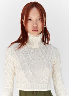 White Long Sleeve Cropped Sweater In Pointelle Knit, White Pointelle Knit Cropped Sweater, White Turtleneck Sweater With Pointelle Knit, Fitted Cropped Sweater For Winter, Winter Cropped Pointelle Knit Sweater, Cropped Pointelle Knit Sweater For Winter, White Fitted Turtleneck Cropped Sweater, Fitted White Turtleneck Cropped Sweater, Cream Turtleneck Cropped Sweater