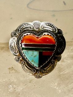 Heart ring Turquoise Coral southwest size 5.50 sterling silver girls women  Signed Q.T. Size 5.50 Between a size 5.50 and a size 5.75 Weight  4.2g Length  7/8" Width  3/4" Thinnest part of band in back  3/16" Free Shipping & Free Postal Insurance  Delivered in a Gift Box  Free First Class shipping and postal insurance is included. If you want to upgrade to priority kindly pay an additional fee to do so.  This is recommended if you would like to have your package delivered faster than first class Southwestern Sterling Silver Turquoise Ring For Anniversary, Nickel-free Southwestern Style Ring As Gift, Nickel Free Southwestern Style Ring As Gift, Southwestern Inlay Jewelry For Anniversary, Southwestern Style Inlay Jewelry For Anniversary, Western Sterling Silver Gemstone Ring, Western Style Sterling Silver Gemstone Ring, Southwestern 925 Stamped Jewelry For Anniversary, Southwestern Multi-stone Jewelry For Anniversary