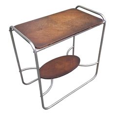 two tiered wooden table with metal frame and wood trays on each side, isolated against a white background