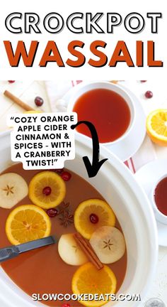 a bowl of crockpot wassail with orange slices and cinnamon