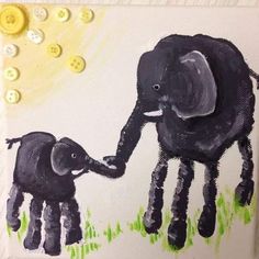 an elephant and its baby are painted on canvases with buttons in the shape of sunbursts