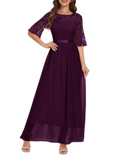 a woman wearing a long purple dress with lace detailing on the sleeves and waistline