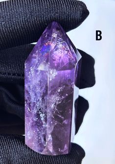 Introducing our magnificent Rainbow Uruguayan Amethyst Pillar, a handcrafted masterpiece symbolizing purity, love, and spiritual enlightenment. Expertly cut and polished by skilled artisans, each piece showcases the finest quality of Uruguayan amethyst, renowned for its deep purple hue and exceptional clarity. What you see is what you get. NATURAL Rainbow, NO Heating! NATURAL Color, NO Dyeing! Each of these hand-cut and polished amethyst pillars is adorned with captivating rainbow reflections, making them rare and desirable gems. Their deep purple color, minimal cotton-like inclusions, and translucence are hallmarks of high-grade quality. Renowned for its healing properties, amethyst promotes peace, intuition, and balance. It is believed to enhance emotional strength, making it an ideal sy Luxurious Decor, Emotional Strength, Amethyst Healing, Deep Purple Color, Amethyst Point, Spiritual Enlightenment, Natural Rainbow, Luxury Decor, Purple Hues