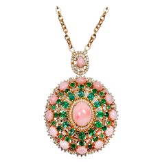 Cast from 14-karat gold, this pendant necklace is hand set with 16.40 carats pink opal, emerald and 4.40 carats of sparkling diamonds on the 29" chain.. FOLLOW MEGHNA JEWELS storefront to view the latest collection & exclusive pieces. Meghna Jewels is proudly rated as a Top Seller on 1stDibs with 5 star customer reviews. All items manufactured by us are handmade and can be customized or redesigned. Composition Total Weight - 43.52 grams 14k Gold - 39.36 grams Diamond 4.40 Carat 16.40 Carat Pink Jewelry Tattoo Designs, Rose Gold Diamond Necklace, Kelly Rutherford, Glitter Jewelry, 1st Dibs, Diamond Pendants Designs, Necklaces Pendant, White Gold Chains, Vintage Pendant