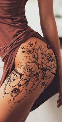 the back of a woman's thigh with flowers on it