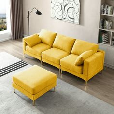 a yellow couch and ottoman in a living room