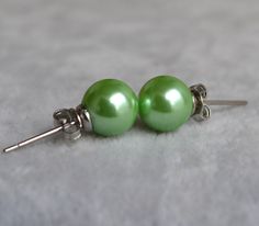 I make the earrings to use about 8mm green glass round pearls and sterling silver post .IT is good earrings for your great wedding. I can make different type earrings to your requirements,Please feel free to contact me if you have any question. Thank you so much. . matching necklace: https://www.etsy.com/listing/188435015/green-pearl-necklacesglass-pearl?ref=shop_home_active_1 Green Pearl Earrings For Formal Occasions, Green Round Pearl Earrings For Formal Occasions, Cheap Green Pearl Earrings, Classic Green Pearl Earrings As Gift, Classic Green Pearl Earrings For Gift, Traditional Green Round Pearl Earrings, Green Round Pearl Drop Earrings, Green Round Classic Pearl Earrings, Classic Green Pearl Drop Earrings