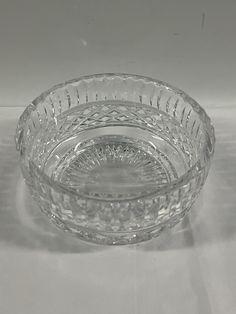 a glass bowl sitting on top of a table