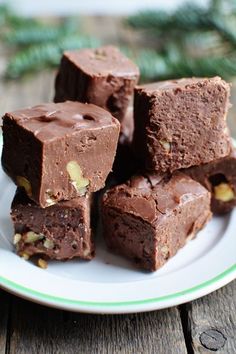 several pieces of brownie on a white plate