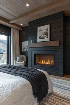 a bedroom with a fireplace in the corner