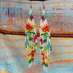 Beautiful Multicolored Beaded Boho Tassel Earrings. Nwt Approximately 4.5” In Length .7” Across Festival Multicolor Tassel Earrings With Dangling Beads, Red Beaded Fringe Earrings For Beach, Traditional Multicolor Beaded Fringe Tassel Earrings, Traditional Multicolor Beaded Tassel Earrings, Colorful Beads Tassel Earrings For Festival, Colorful Beaded Tassel Earrings For Festival, Adjustable White Tassel Earrings With Colorful Beads, Multicolor Fringe Beaded Earrings For Beach, White Tassel Earrings With Colorful Beads