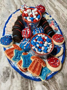 patriotic desserts and cookies on a blue plate