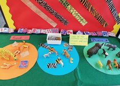 an assortment of animal themed paper plates on display