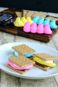 some cookies and marshmallows on a white plate