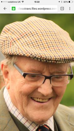 an older man wearing glasses and a hat