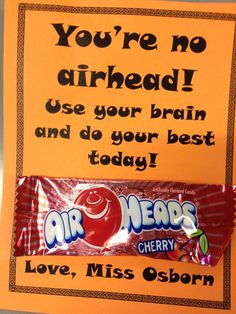 a candy bar with an ad for air nerds on the front, and a sign that says you're no already use your brain and do your best today