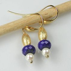 Fine Lapis Lazuli, White Pearl and Vermeil Earrings AAA quality faceted Lapis Lazuli rondel gemstones, white freshwater Pearls and gleaming brushed Vermeil (sterling silver coated with 18 karat gold) beads hang on beautiful teardrop gold-plated ear hooks. I securely wire-wrapped the Lapis Lazuli, Pearls and Vermeil with fine gold-filled wire onto onto the earring hooks. The earrings are 1 3/4 inches from the top of the earring hook to the bottom bead. The drop (the part below the ear wire) is 1 inch. They will come with flexible silicon earring stopples to keep your earrings secure. The earrings can be worn as a set with the Lapis Lazuli and Vermeil Adjustable Station Necklace (seen in the second photo) https://www.etsy.com/listing/579035953/lapis-lazuli-and-vermeil-station?ref=shop_home_a Elegant Dangle Earrings With Faceted Beads, Faceted Beads Briolette Earrings For Gift, Briolette Faceted Beads Earrings As Gift, Faceted Briolette Beads Earrings For Gift, Elegant Blue Faceted Beads Earrings, Elegant Teardrop Jewelry With Faceted Beads, Gift Faceted Beads Drop Earrings, Round Faceted Beads Earrings As Gift, Elegant White Earrings With Faceted Beads