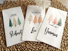 three tea towels with trees printed on them