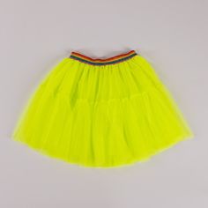 Light up the room (literally) with our A Leading Role Premium Short Neon Yellow Tulle Skirt! This sheer tulle skirt features a rainbow waistband and glows under UV black light for an extra touch of fun. Perfect for parties, dress-up, or just adding a pop of color to any outfit. Keepsake quality. Made in the USA. Yellow Tulle Skirt, Skirts Flowy, Uv Black Light, Maxi Skirt Boho, Tiered Maxi Skirt, Slip Skirt, Fabric Tape, Boho Maxi, Bottom Clothes