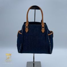 Burberry Denim Handbag In Very Good Condition Noticeable Flaws: Minor Stitch Frayed In The Handle And Water Marks. Exterior: Denim Fabric Interior: Fabric Nylon Hardware: Silver Approx.: 9 X 9 X 5 "Please Refer To Photos For Additional Details" Available In Store And Website Purchase For $ 240 Uispsolpi82408 Denim Blue Shopping Bag With Double Handle, Shopping Bag With Double Handle In Denim Blue, Denim Blue Double Handle Shopping Bag, Luxury Denim Tote Shoulder Bag, Luxury Denim Blue Shoulder Bag For Daily Use, Luxury Denim Blue Shoulder Bag For Travel, Luxury Denim Tote Bag, Luxury Denim Blue Bag For Daily Use, Denim Blue Bag With Leather Handles