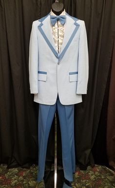 Vintage 1960's Men's After Six Light Blue Polyester 4 Piece Tuxedo Suit Approx Size 38-40 Jacket, Vest, Pants, Shirt, Matching Bowtie.  Suit is in great condition! Please see all pics! Vest is adjustable and so are the pants. Coat Measurements: Shoulder to shoulder 16 1/2, neck to bottom hem 31 1/2, sleeve shoulder to cuff 25, sleeve pit to cuff 18, chest 38, waist 36 inches. Pants Measurements: Waist adjustable to 30 31 32 (pants have an additional 1 1/2 inches inside waist for expansion), leng Vintage Blue Blazer For Formal Occasions, Fitted Vintage Blue Suits, Vintage Fitted Blue Suits, Blue Fitted Vintage Suit, Retro Tailored Suit With Notch Lapel, Vintage Blue Blazer With Notch Lapel, Retro Fitted Suits With Pockets, Vintage Blue Blazer With Lapel Collar, Blue Vintage Blazer With Lapel Collar