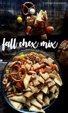 a bowl filled with cereal and pretzels next to some candy cornflakes