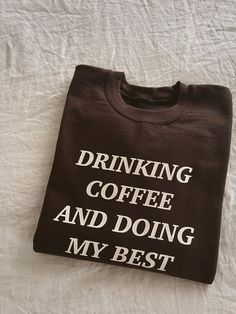 life motto: drinking coffee and just doing my best :) espresso sweatshirt with cream colored print SWEATSHIRTS: - 50/50 poly cotton fleece blend - relaxed unisex crewneck with rib-knit banding at cuffs CARE INSTRUCTIONS: - machine wash inside out, cold with like colors - tumble dry low or hang to dry Doing My Best, Life Motto, Coffee Sweatshirt, Best Espresso, Coffee Shirt, Drinking Coffee, Coffee Shirts, Cotton Fleece, Printed Sweatshirts