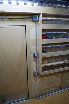 the inside of a wooden cabinet with sliding glass doors