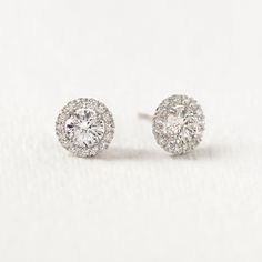 These sparkly round stud earrings feature a halo around the main stone. Quality 14K White Gold is tarnish free, so you never have to take these off! 14K White Gold Cubic Zirconia pave crystals Hypoallergenic post Diameter: 6mm, 8mm #ES073 Round Stud Earrings, Diamond Earrings, Halo, Cubic Zirconia, White Gold, Stud Earrings, Crystals, Stone, Gold