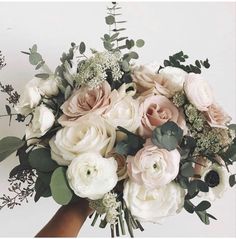 a bouquet of white and pink flowers in a vase